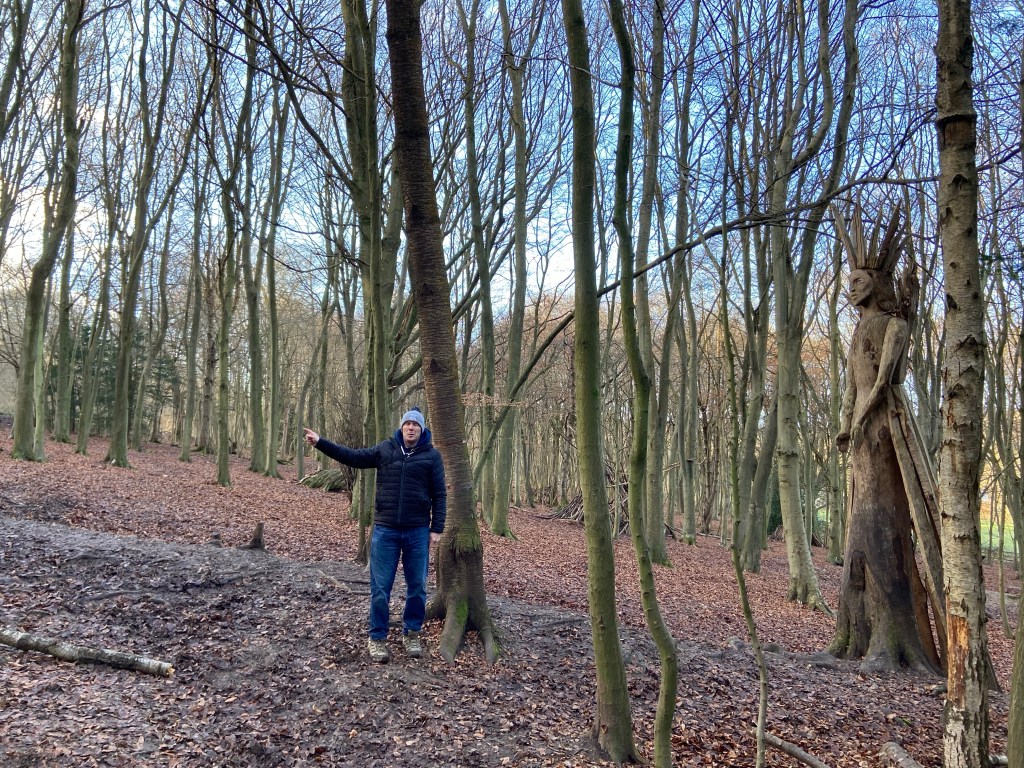 Jim pointing the way from the Snow Queen, a wooden statue that forms part of the Narnia-themed trail 
